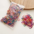 Detailed macro of vibrant elastic hair bands in a transparent bag on wooden tray - Deep Color Series (1000Pcs)
