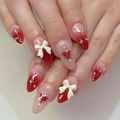 Detail of long almond press-on nails with 3D white bows and red heart charms - Ys504 (without Tools)