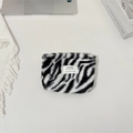 Detail of plush zebra print cosmetic bag with soft texture and stylish zipper closure - Lipstick Pouch / Zebra Print