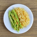Miniature PVC prop of green beans with yellow rice in a white plate on wood - Green Pepper Rice Bowl