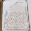 Detail view of cotton floral rabbit pattern on cream-colored canvas crossbody bag - Rabbit with Yellow Flowers