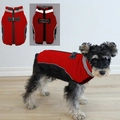 Macro shot of red quilted dog vest featuring reflective strips and back zipper detail - Reflective Traction Jacket - Red