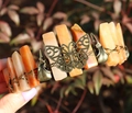 Vintage bronze butterfly and orange crystal stone bracelet with skull accents on wrist - Butterfly Raven Skull Style / Red Aventurine/Antique Bronze Wire