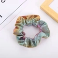 Detailed close-up of rainbow gradient scrunchie with metallic luster and fine texture - Metallic Holographic
