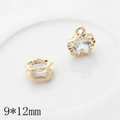 Macro detail of 9x12mm gold flower pendants with clear zircon for DIY jewelry making - Five-Petal Flower