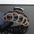 Classic large hair claw clip with gold and silver rhinestones in circular patterns - Gold Silver Rhinestones