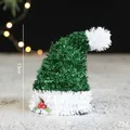 Mini green sequin Christmas hat 13cm with holly berry detail on snowy background - Green Mini Christmas Hat