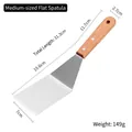 Medium stainless steel fish spatula with beech wood handle and rivet fastening - Medium Solid Turner