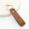 Brown leather loop keychain with golden metal heart pendant and engraved text - Coffee