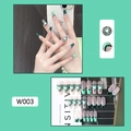 Detailed view of dark green and mint French coffin nails with heart patterns in 24 piece set - W003 Mint Green Heart