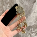 Ethnic style gold dangling earrings with circular engraved plates and tiny bells - Black Velvet Gold Tassel BB Clip