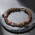 Detail of beaded necklace with turquoise and wood beads on a dark slate stone - ZJ12524-Ethnic Style Wood and Stone Woven Bracelet