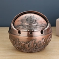 Bronze round metal ashtray with rotating lid featuring embossed sailing boat and waves - Red Copper Smooth Sailing Ship