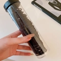Detail of black elastic hair ties set in a clear plastic storage tube with screw cap - 5# Black (100 Pcs)