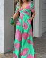 Close-up of V-neck jumpsuit with tropical green and pink leaf print detail - S / Green Pink Print