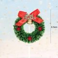 Miniature Christmas wreath cake topper with red bow, gold bell and 6.5cm size label - Red Berry Decor Pine Wreath Style