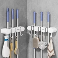 White wall-mounted suction mop holder with gravity rollers and hooks for bathroom storage - 3 Clips 4 Hooks Cream White 2Pcs