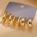 Set of six minimalist golden C-shaped hoop earrings displayed on a grey display card - Gold (6-Piece Set)