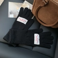 Black knitted winter gloves featuring French embroidery and thick ribbed cuffs - M / Black
