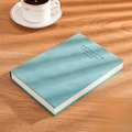 A5 teal leather business notebook with Manage Time debossed cover on wooden table - Ruled / A5-Algae Green