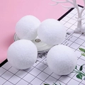 Detailed view of four fluffy white snowball ornaments for Christmas tree decoration - Single 7cm White / White