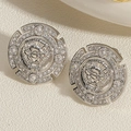 Close-up of silver lion head earrings with sparkling pavé-set stones and ornate details - Silver Lion Head Zirconia Stud Earrings
