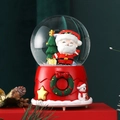Detailed view of a festive Christmas snow globe with Santa and a tree on a red resin base - Christmas Tree and Santa (2207Y)