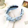 Detail of light blue knotted headband featuring white pearls and sparkling rhinestones - Sky Blue