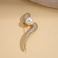 Detailed close-up of 14k gold plated twisted brooch with zircons and a large white pearl - Gold-Snake