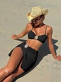 Detail of black ribbed bikini set with silver teardrop jewels on a sunny beach - Black