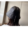 Detailed back view of a black leather bucket hat featuring a stylish silver zipper closure - Flat Top with Zipper Decor / Black
