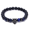 Detailed shot of tiger eye beads and matte black beads with a zircon wolf head charm - Blue Tiger Eye Style