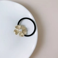 Elegant gold metal flower hair tie with central pearl and black elastic band - FB2675 Gold Five-Petal Flower