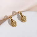 Artistic 18K gold plated stainless steel earrings with female torso sculpture detail - Body Pendant Thick Hoops