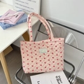 Close-up of pink quilted tote bag with red heart patterns and Sezakka Studio label - Mini Pink Hearts