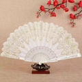 Elegant white lace folding fan with gold patterns on a wooden display stand - Standard Type / White