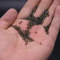 Deep brown 2/3/4mm silver-lined glass seed beads held in hand for DIY jewelry making - 2mm / 15g / Gunmetal