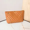 Quilted caramel brown tote bag with gold chain strap and elegant turn-lock closure - Brown