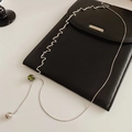 Detail of silver wavy chain necklace with green square zircon and spherical pendant - Silver-Green