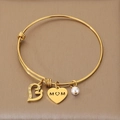 Adjustable golden MOM bangle featuring a mother-child silhouette heart and white pearl - Rhinestone Hollow Mother-Child Style (KB203622-Z)