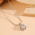 Macro shot of silver snake chain with hexagonal pendant and sparkling cubic zirconia stones - Silver Tone White Zircon Necklace