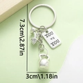 Silver fitness keychain with dumbbell and kettlebell charms and YOU vs YOU plate - YOU VS YOU