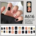 Süße Cartoon-Welpen Kunstnägel Set in Schwarz und Nude-Rosa mit 24 Nagelspitzen - Niedlicher Hundepfotenabdruck-Stil (A616)
