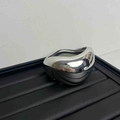 Minimalist silver irregular geometric metallic ring with spring closure on black stand - Silver