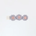 Detail showing three embroidered floral hair clips with purple petals and pink centers - Grey Purple
