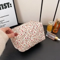 Floral quilted makeup bag in off-white with red and orange flower patterns and zipper - Orange Floral