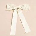 Elegant cream white bow hair clip featuring intricate floral lace and satin long ribbons - White Lace
