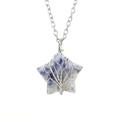 Macro detail of star-shaped sodalite pendant with silver tree of life wire wrapping - Silver + Lapis Lazuli