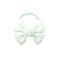 Detail view of a mint green ribbed grosgrain bow hair tie with elastic band for styling - Mint Green