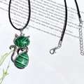 Silver cat pendant necklace featuring green malachite stone inlay on a black wax cord - Peacock